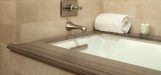 residence-bath-with-crema-marfil-marble-walls-and-bathtub-by-toto
